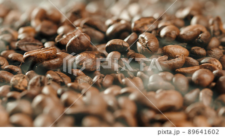 High Quality coffee production with coffe beans and smoke in oven 89641602
