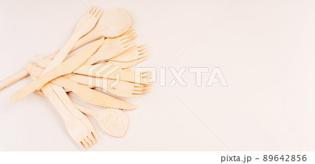 Banner eco friendly disposable kitchenware utensils on white background.Wooden forks,spoons,zero waste.Copy space.Eco friendly wooden cutlery.plastic free concept.Disposable wooden cutlery.Eco concept Banner eco friendly disposable kitchenware utensils on white background.Wooden forks,spoons,zero waste.Copy space.Eco friendly wooden cutlery.plastic free concept.Disposable wooden cutlery.Eco concept 89642856