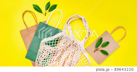 Eco Bags.Zero waste, eco friendly shopping.Top view,flat lay.A variety of eco bags on a yellow background . Sustainable lifestyle.Zero waste minimal composition with tring and canvas bags for storage. 89643220