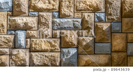 Pattern of beige and gray decorative uneven stone wall surface Pattern of beige and gray decorative uneven stone wall surface 89643639