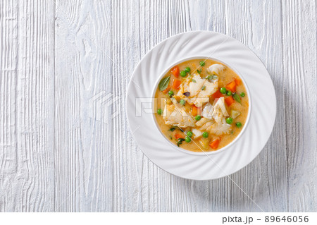 white fish chowder with green peas, potatoes 89646056