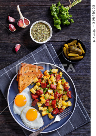 Corned Beef Hash Browns with fried eggs, top view 89646058