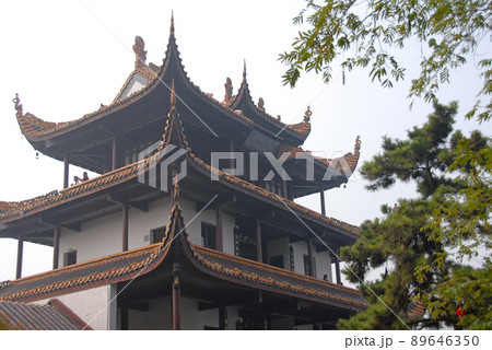 Changsha, Hunan Province, China: Tianxin Pavilion is an old Chinese pavilion located on the ancient city wall of Changsha, Hunan. View of the main pavilion from below with trees. Changsha, Hunan Province, China: Tianxin Pavilion is an old Chinese pavilion located on the ancient city wall of Changsha, Hunan. View of the main pavilion from below with trees. 89646350