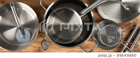 Kitchen utensil on wooden table, top view Kitchen utensil on wooden table, top view 89649860