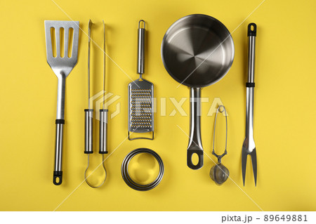 Kitchen utensil on yellow background, top view Kitchen utensil on yellow background, top view 89649881
