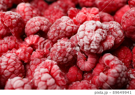 Frozen red raspberry all over background,close up Frozen red raspberry all over background,close up 89649941
