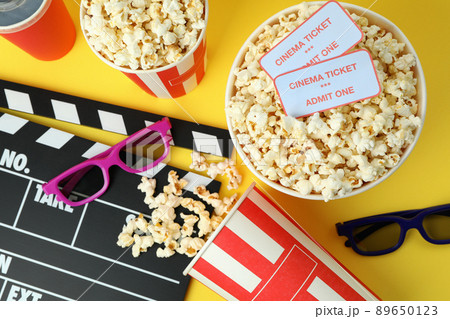 Concept of cinema accessories on yellow background 89650123