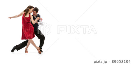 Beautiful girl and stylish man in vintage retro style outfits dancing isolated on white background. Timeless traditions, 60s,70s american fashion style and art 89652104