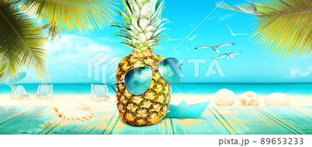 Creative pineapple with sunglasses on summer background. Creative pineapple with sunglasses on summer background. 89653233