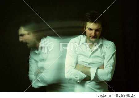 schizophrenic portrait of a man with mental disorders and mental illnesses in a straitjacket 89654927