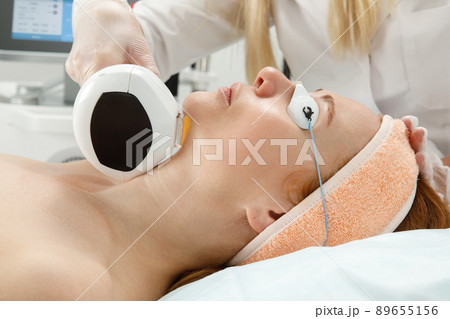 The procedure of hardware liposuction of the neck and chin. Removal of the second chin in a woman. 89655156