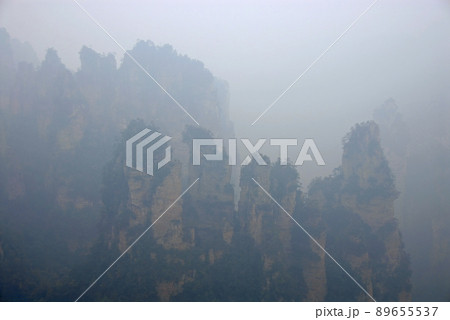 Zhangjiajie National Forest Park, Hunan Province, China: Misty mountains and forest scenery in Zhangjiajie. This Chinese national park is famous for its tall rocky pinnacles, trees and swirling mist. 89655537