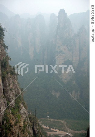 Zhangjiajie National Forest Park, Hunan Province, China: Misty mountains and forest scenery in Zhangjiajie. This Chinese national park is famous for its tall rocky pinnacles, trees and swirling mist. 89655538
