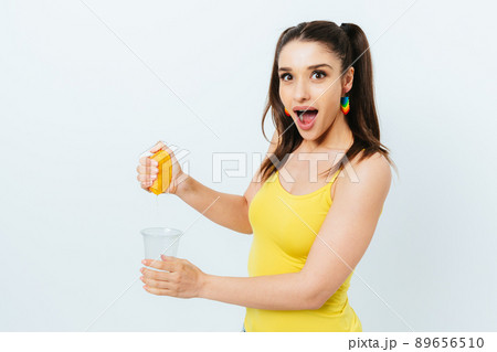 Excited surprised young woman in summer outfit 89656510