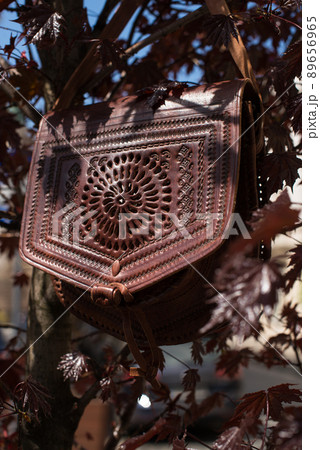 small burgundy women's leather bag with a carved pattern 89656965