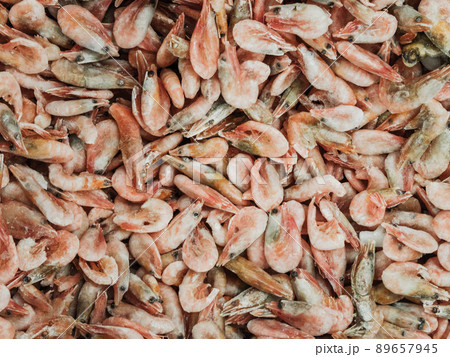 Frozen sea prawns in the refrigerator in the store 89657945