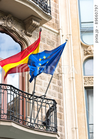 Flags of Spain and United Europe on balcony Flags of Spain and United Europe on balcony 89660797