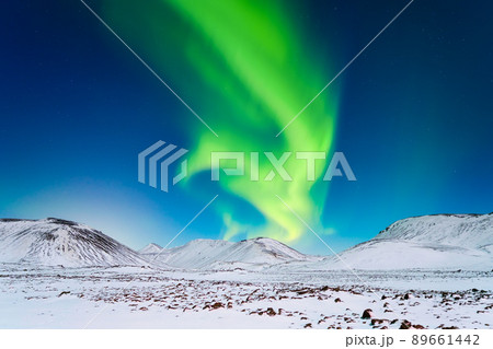 Northern Lights over the mountains. A winter night landscape with bright lights in the sky. Northern Lights over the mountains. A winter night landscape with bright lights in the sky. 89661442