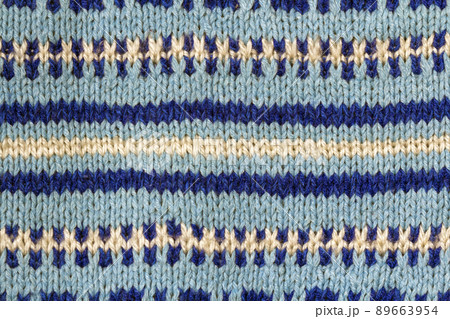 Background texture of blue pattern knitted fabric made of cotton or wool closeup Background texture of blue pattern knitted fabric made of cotton or wool closeup 89663954