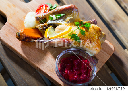 Poultry dish with cranberry sauce 89668759