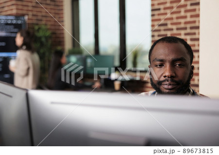 African american programmer developing high security application with multiple layers of scalability. Advanced technology cyber developer creating a node network using binary encryption. African american programmer developing high security application with multiple layers of scalability. Advanced technology cyber developer creating a node network using binary encryption. 89673815