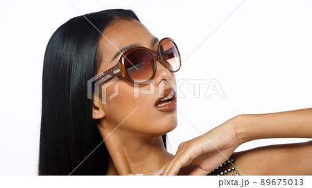 Half body of 20s Asian woman tanned skin black long straight hair with Fashion Luxury glasses 89675013