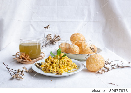 Homemade pani puri, Golgappa Indian snack on cotton calico background Homemade pani puri, Golgappa Indian snack on cotton calico background 89677838