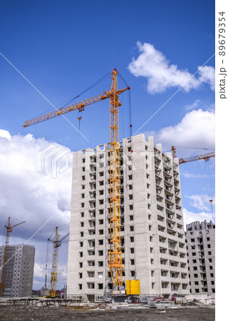 New multistorey housing and tall cranes New multistorey housing and tall cranes 89679354