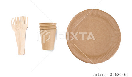Brown paper cups, wooden fork and plates on a white background. Recyclable garbage, rejection of plastic, Brown paper cups, wooden fork and plates on a white background. Recyclable garbage, rejection of plastic, 89680469