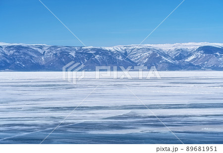 Winter landscape with mountains and Lake Baikal in Siberia on sunny day. Natural background. 89681951
