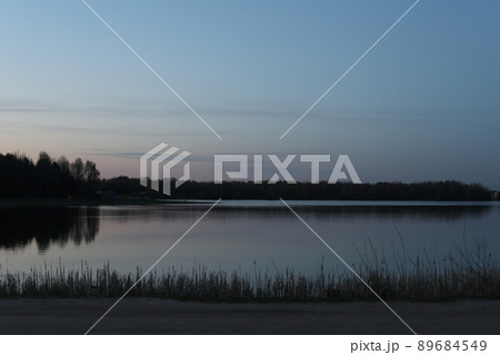sunset at coast of the lake. Nature landscape. Landscape during sunset. 89684549