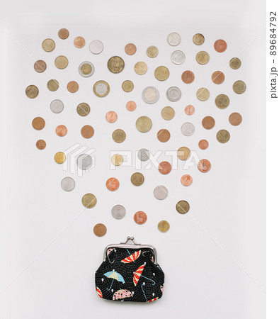 Open wallet with different coins isolated on white background top view. Financial crisis, poverty, lack of money concept Open wallet with different coins isolated on white background top view. Financial crisis, poverty, lack of money concept 89684792