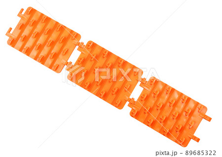 orange plastic foldable emergency traction pads isolated on white background orange plastic foldable emergency traction pads isolated on white background 89685322