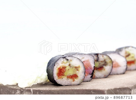 sushi rolls on a cutting Board.isolated on white sushi rolls on a cutting Board.isolated on white 89687713