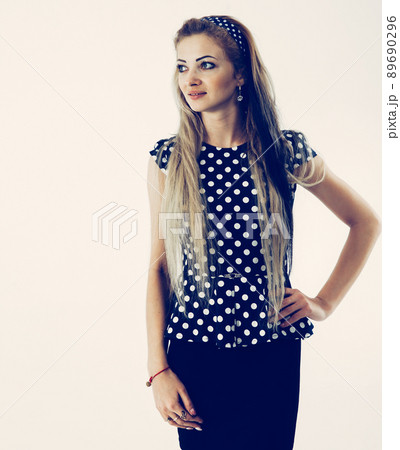 portrait of a young woman - administrator in a stylish suit on a portrait of a young woman - administrator in a stylish suit on a 89690296