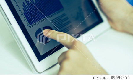 businessman using digital tablet, working with the financial sc 89690459