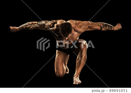 bodybuilder posing. Beautiful sporty guy male power. Fitness muscular body. Isolated on black background bodybuilder posing. Beautiful sporty guy male power. Fitness muscular body. Isolated on black background 89691051