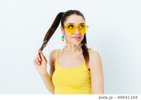 Brunette young woman wearing summer outfit Brunette young woman wearing summer outfit 89691168