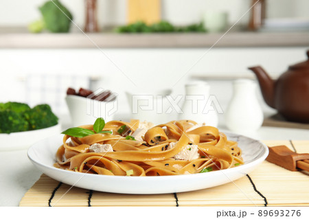 Tasty buckwheat noodles with meat served on kitchen table 89693276
