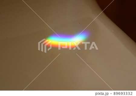 Multicolored sunbeam reflected on tiles Multicolored sunbeam reflected on tiles 89693332