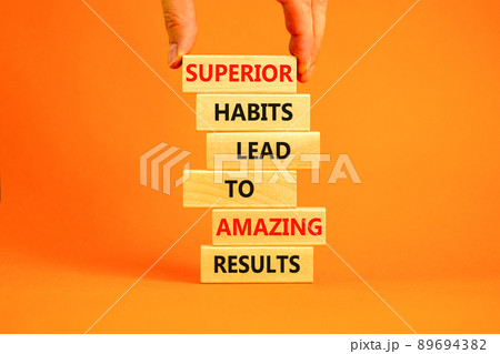 Good habits symbol. Wood blocks with words Superior habits lead to amazing results. Beautiful orange background Businessman hand. Business motivational good habits and result concept. Copy space. Good habits symbol. Wood blocks with words Superior habits lead to amazing results. Beautiful orange background Businessman hand. Business motivational good habits and result concept. Copy space. 89694382