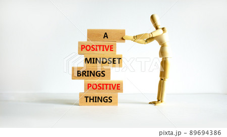 Positive mindset symbol. Wood blocks with words A positive mindset brings positive results. Beautiful white background Businessman model. Business motivational positive mindset concept. Copy space. 89694386