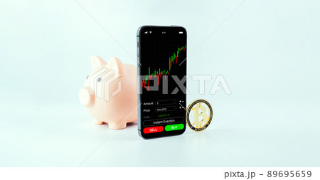 Crypto currency exchange. Pink pig bank, gold crypto currency BTC bitcoin on white background. Bitcoin trading mobile phone app. Save money investment and business finance. Crypto currency exchange. Pink pig bank, gold crypto currency BTC bitcoin on white background. Bitcoin trading mobile phone app. Save money investment and business finance. 89695659