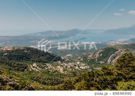 Beautiful nature mountains landscape. Kotor bay, Montenegro. Views of the Boka Bay, with the cities of Kotor and Tivat with the top of the mountain, Montenegro Beautiful nature mountains landscape. Kotor bay, Montenegro. Views of the Boka Bay, with the cities of Kotor and Tivat with the top of the mountain, Montenegro 89696990