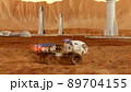 Martian rover drives across the rocky surface, observing the colonists base inside of the crater. 4K footage 89704155