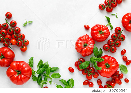 Tomatoes and basil on white background, top view, flat lay 89709544