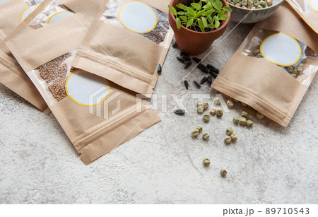 Microgreen seeds in paper bags and equipment for sowing microgreens. Microgreen seeds in paper bags and equipment for sowing microgreens. 89710543