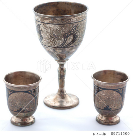 Set of silver wine glasses on a white background 89711500