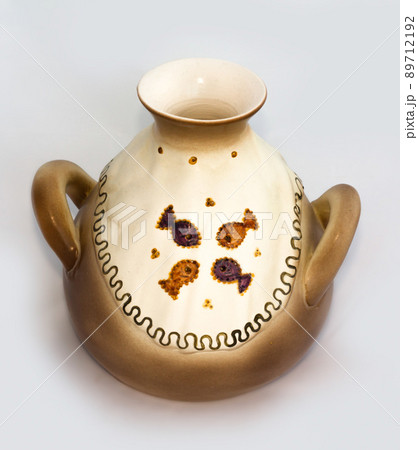 Ceramic fish jug isolated on white background Ceramic fish jug isolated on white background 89712192