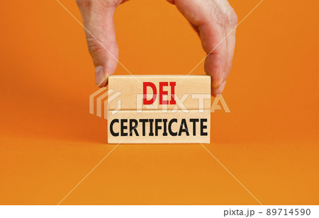 DEI diversity equity inclusion certificate symbol. Blocks with words DEI certificate on beautiful orange background. Business DEI diversity equity inclusion certificate concept. Copy space. 89714590